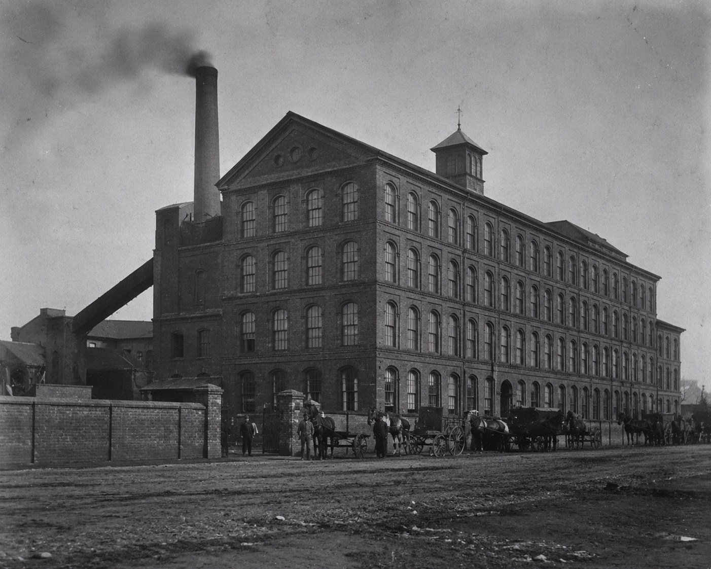 Plate 54 — Brick factory exterior, daytime, horse carts