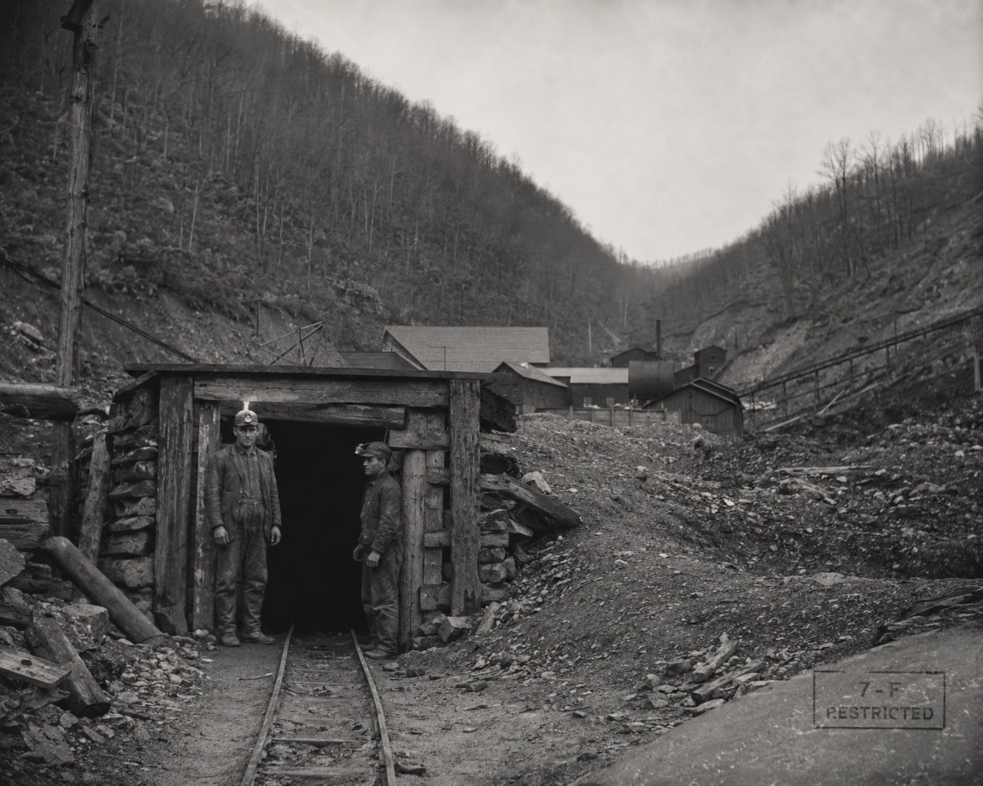 Plate 110 — Mine shaft entrance, two workers, Colliery District